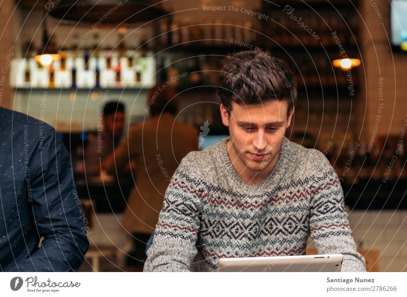 Businessman using his laptop in the Coffee Shop. Man Friendliness Portrait photograph Youth (Young adults) Human being Lifestyle Communication Computer Notebook