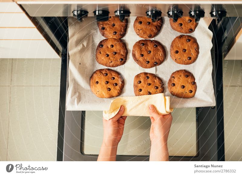 Beautiful woman Preparing Cookies And Muffins. Baking Stove & Oven biscuit chef Woman Decoration Delicious Home-made Cooking Egg Sugar Butter Lemon Flour Food