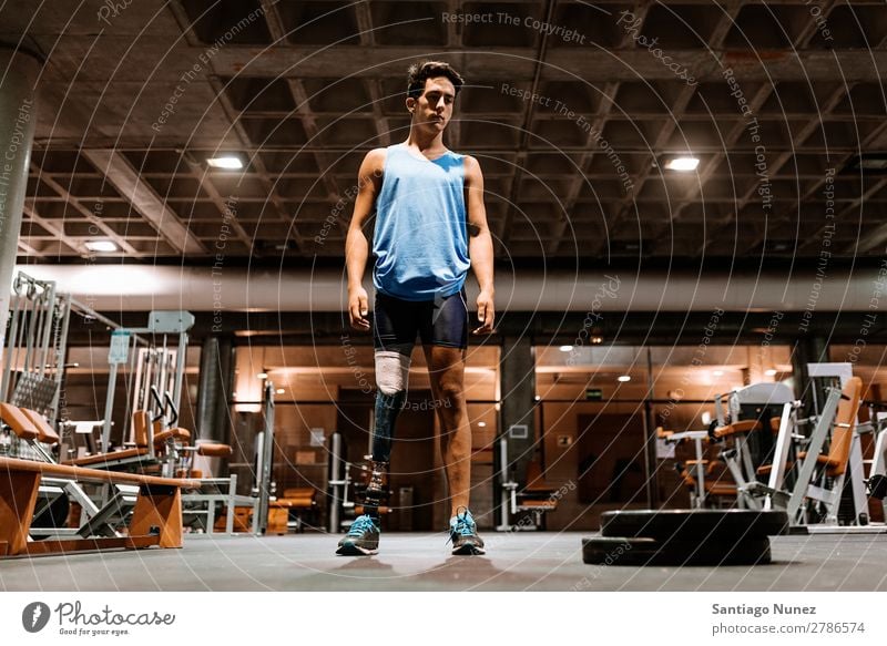 Portrait of disabled young in the gym. Man Youth (Young adults) Athlete Sports prothestic Portrait photograph Handicapped paralympic Fitness Gymnasium Action