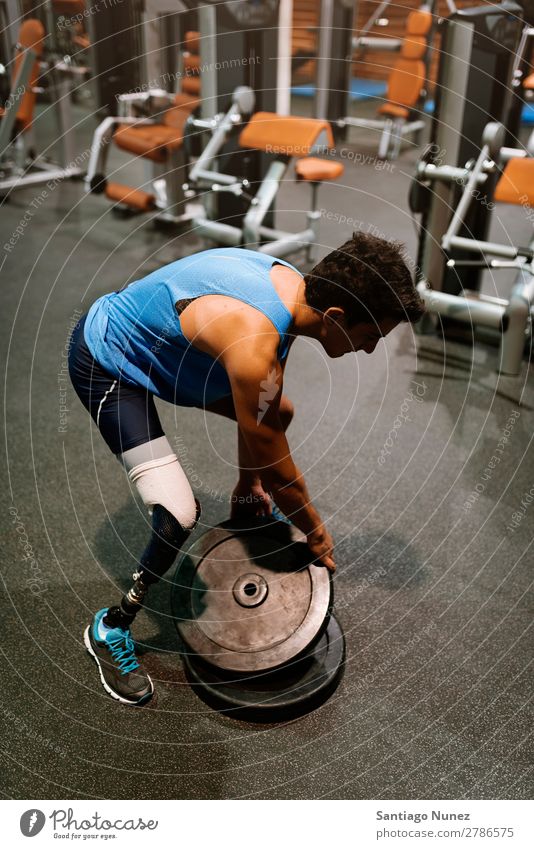 Disabled young man training in the gym Man Youth (Young adults) Athlete Sports prothestic Portrait photograph Handicapped disabled paralympic Practice Fitness