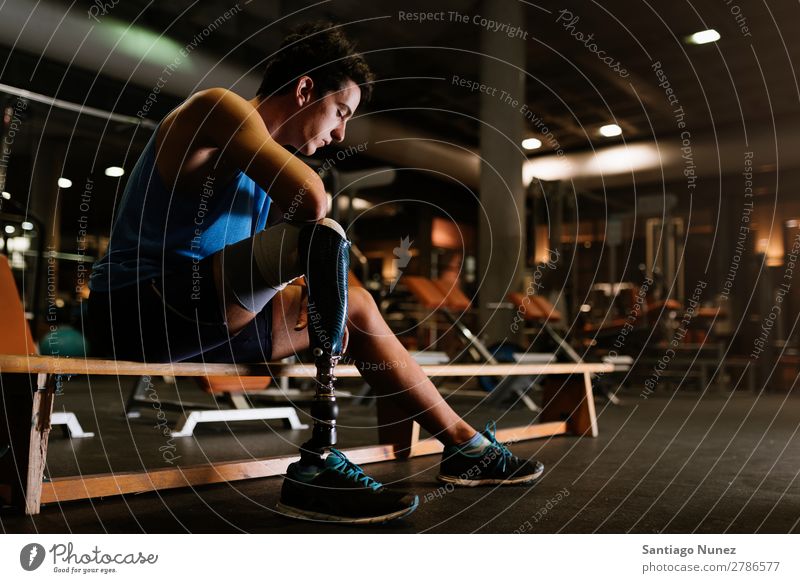 Portrait of disabled young in the gym. Man Youth (Young adults) Athlete Sports prothestic Portrait photograph Handicapped paralympic Fitness Gymnasium Action