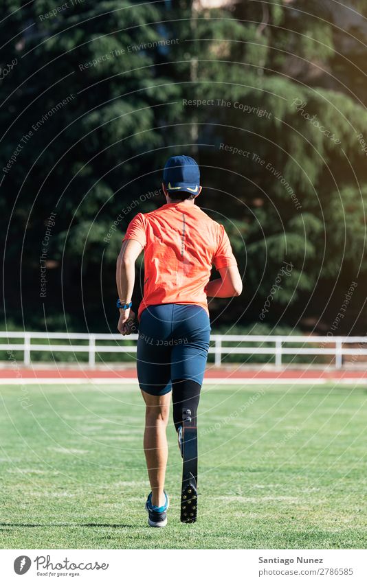 Disabled man athlete training with leg prosthesis. Man Running Runner Athlete Sports prosthetic Handicapped disabled paralympic amputation amputee invalid