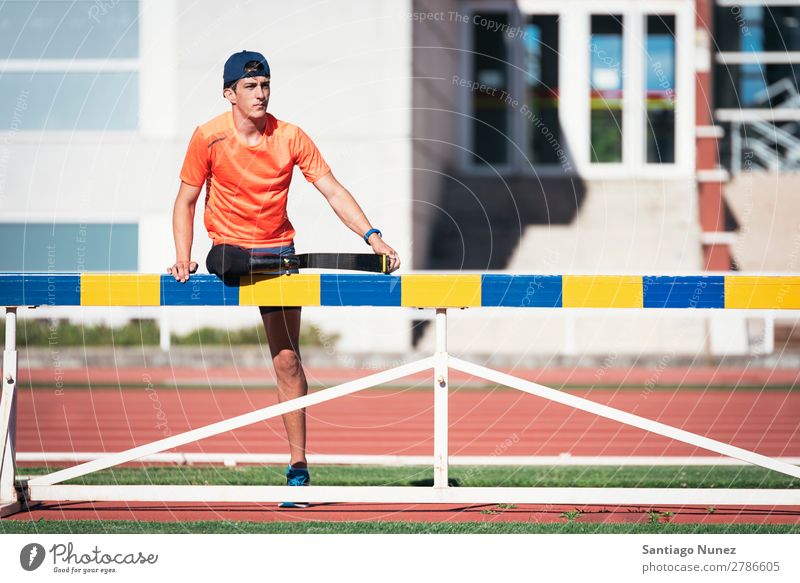 Disabled man athlete stretching with leg prosthesis. Man Runner Stretching Athlete Sports prosthetic Handicapped disabled paralympic amputation amputee invalid