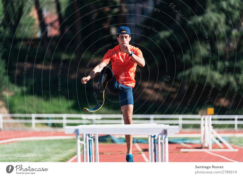 Disabled man athlete training with leg prosthesis. Man Running Runner Fitness Jump Athlete Sports prosthetic Handicapped disabled amputation amputee invalid