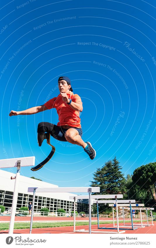 Disabled man athlete training with leg prosthesis. Man Running Runner Jump Athlete Sports prosthetic Handicapped disabled paralympic amputation amputee invalid