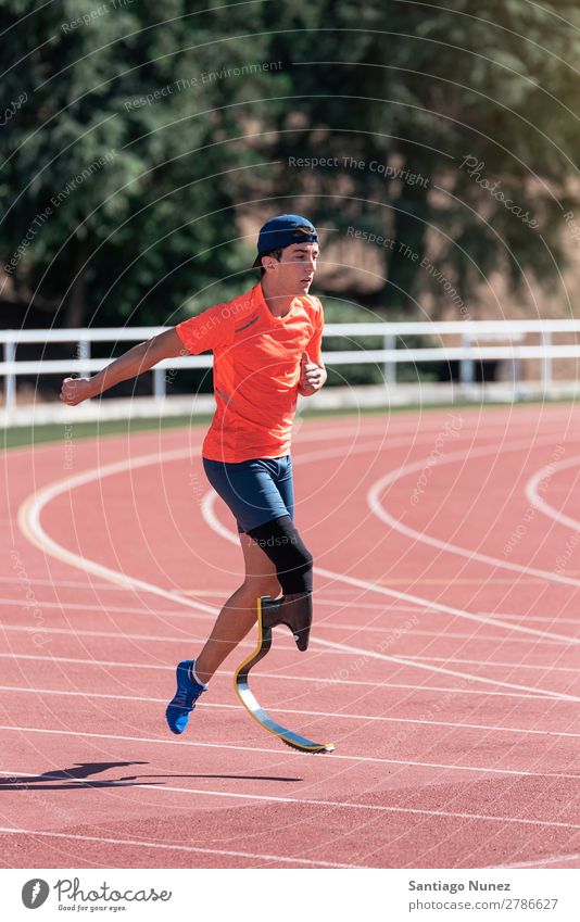 Disabled man athlete training with leg prosthesis. Man Running Runner Athlete Sports prosthetic Handicapped disabled paralympic amputation amputee invalid