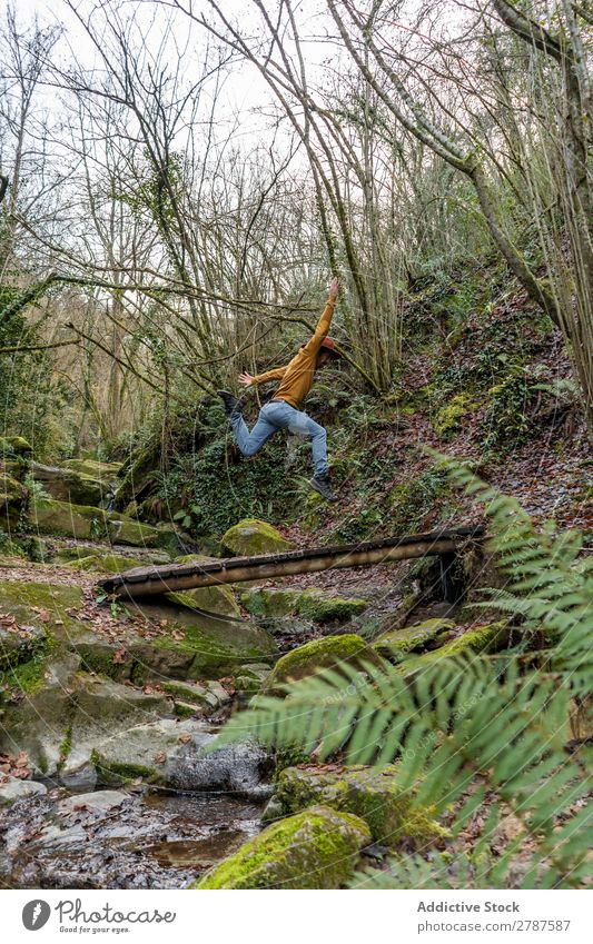 Man jumping over brook in forest Jump Brook Forest Spain gorgues de la garrotxa Catalonia Stream Water Nature Leisure and hobbies Action Lifestyle Easygoing