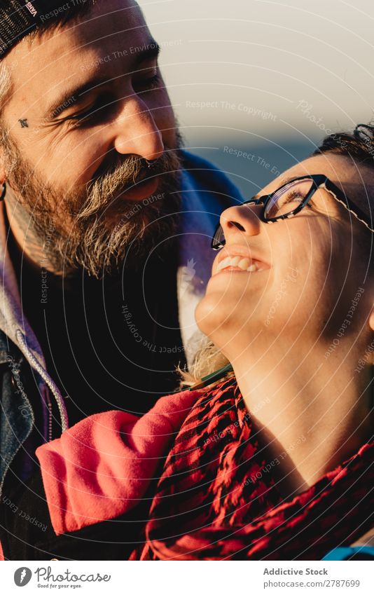 Happy couple hugging and kissing near tree in park Couple Embrace Park Tree embracing Back Wood Forest Youth (Young adults) Cheerful bearded Man Woman Joy