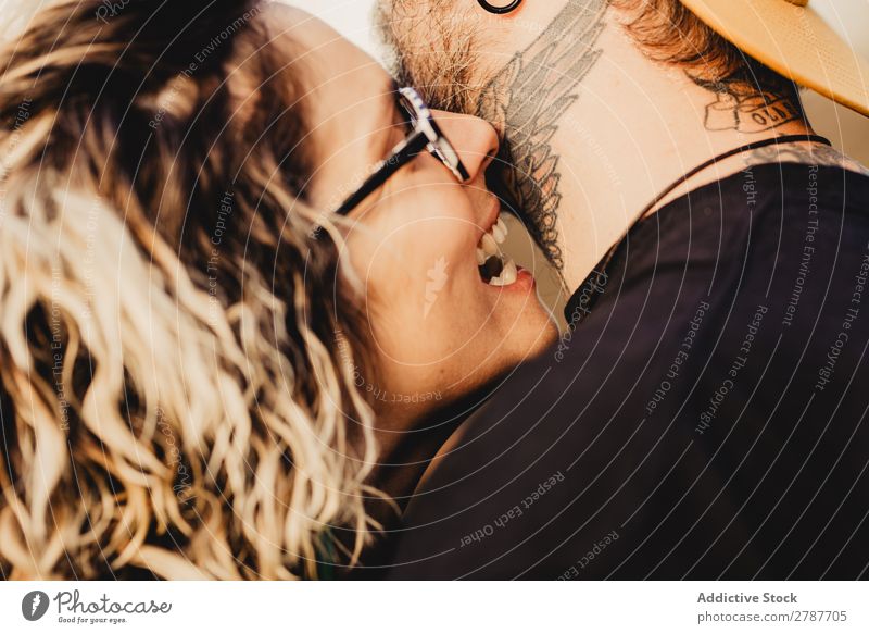 Happy couple hugging and kissing near tree in park Couple Embrace Park Tree embracing Back Wood Forest Youth (Young adults) Cheerful bearded Man Woman Joy