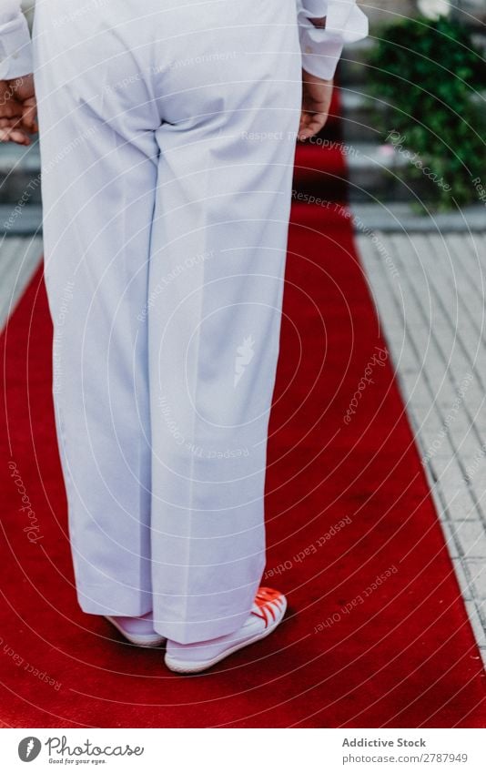 Person in white cloth and gym shoes jumping on red carpet Red carpet Human being Suit Cloth White Jump Legs Street Wear Carpet Lifestyle Luxury Success