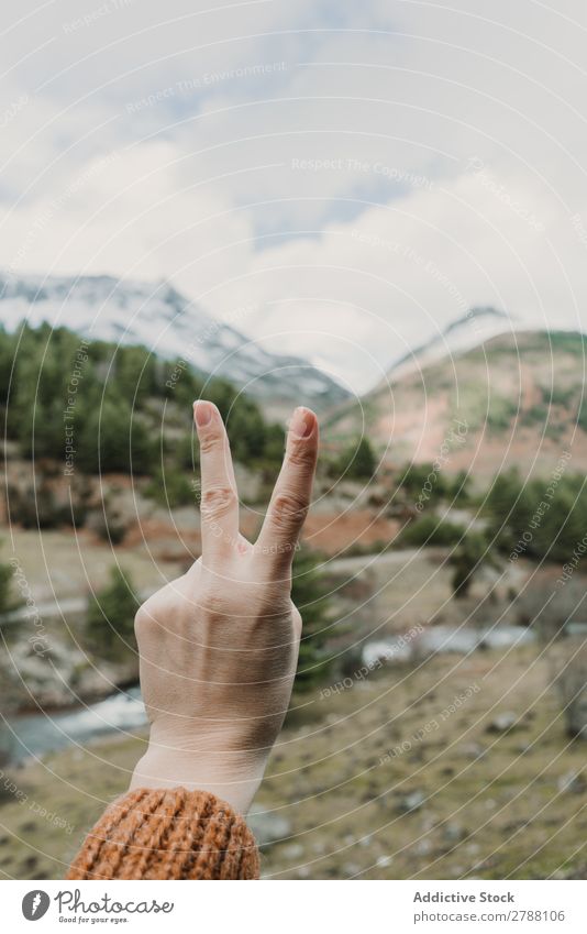 Woman showing two gesture near valley with high hills in cloudy weather 2 Gesture Valley Pyrenees Hill Clouds Lady Mountain Heaven Height Indicate Success