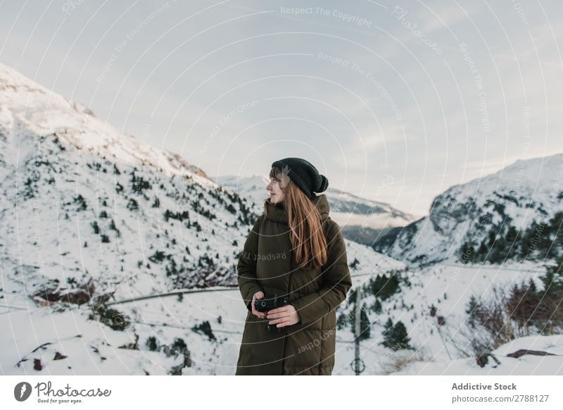 Young woman in ski jacket with camera between mountains Woman Camera Mountain Pyrenees Lady Hat Snow Hill Wonderful Youth (Young adults) Cold Wear Warmth Cloth