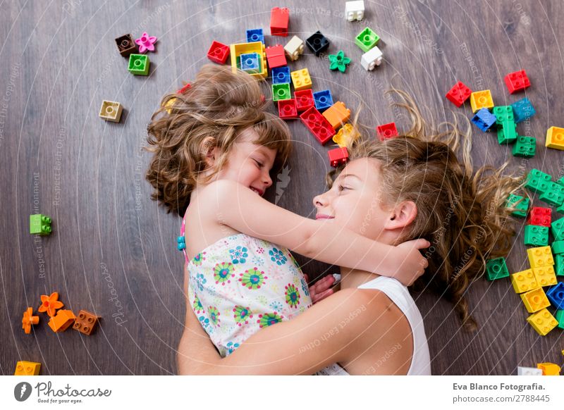 two beautiful sisters playing at home Lifestyle Joy Happy Leisure and hobbies Playing House (Residential Structure) Bed Kindergarten Child School Feminine Baby