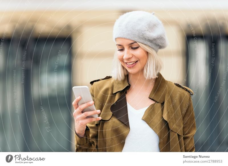 Portrait of a Young woman using her mobile phone. Woman Portrait photograph Youth (Young adults) Blonde Happy Girl Beautiful Mobile Telephone Cellphone