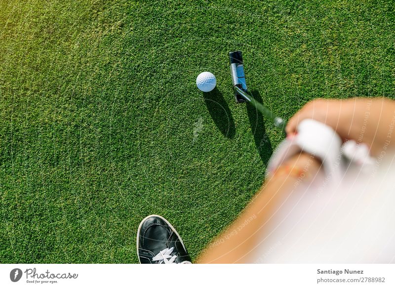 Woman golf player concentrating. Golf Player Girl Luxury Lifestyle Golfer Course (flight) Green Club Youth (Young adults) Close-up Hand Arm put Human being