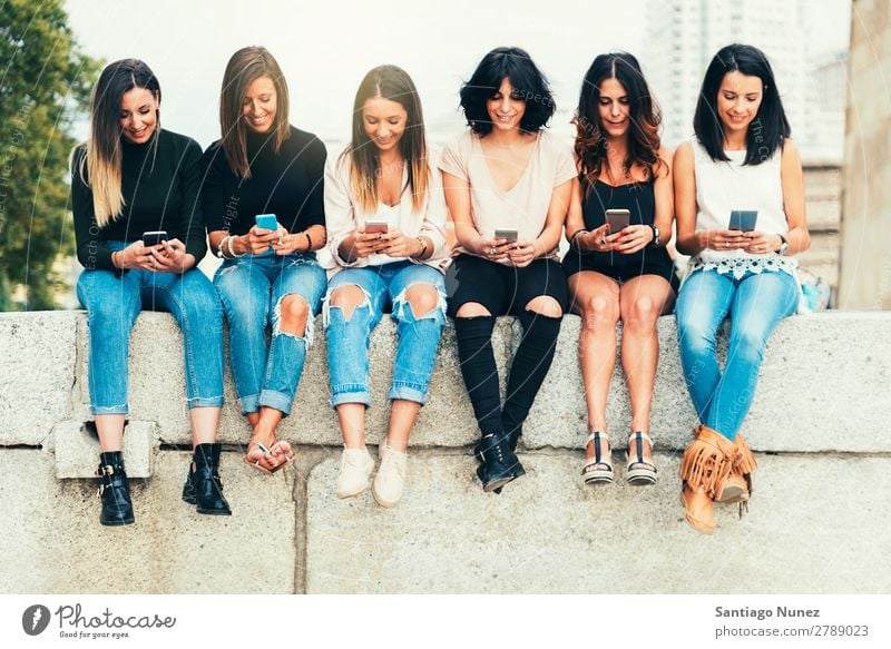 Big Group of friends using cellphones. Friendship Mobile Telephone PDA Human being Youth (Young adults) Woman Smart Technology Beautiful Lifestyle pretty