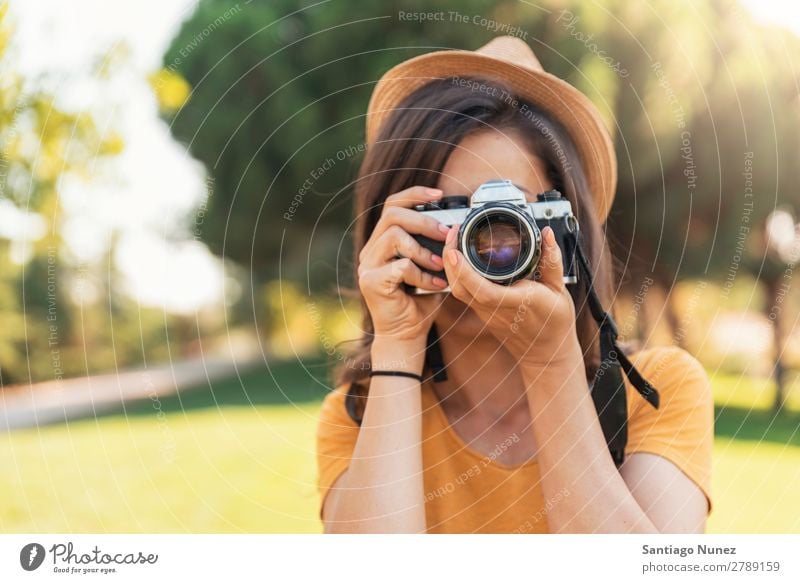 Young woman using a camera to take photo. Photographer Woman Photography Camera Youth (Young adults) Girl Digital White Leisure and hobbies 1 Take analogical