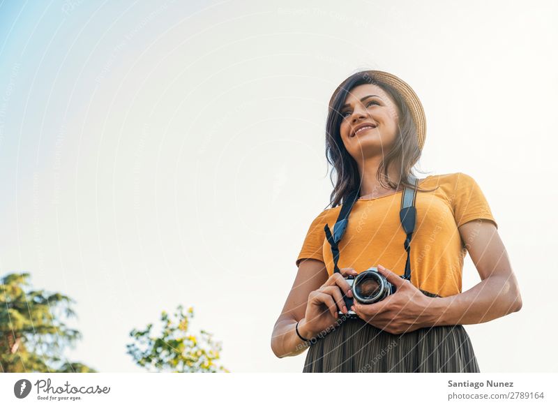 Young woman using a camera to take photo. Photographer Woman Photography Camera Youth (Young adults) Girl Digital White Leisure and hobbies 1 Take analogical