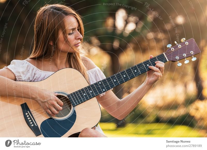 Beautiful woman playing guitar. Woman Picnic Youth (Young adults) Guitar Guitarist Park Happy Summer Human being Joy Playing Music Adults Girl pretty