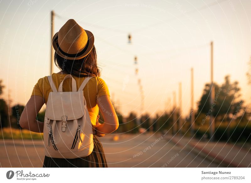 Back view of young woman looking the road. Woman Hope Dress Spring Youth (Young adults) Autumn Sunset Vantage point Beautiful Sunlight Summer Love Looking Dream