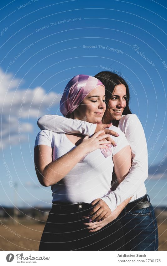 Two young beautiful woman with cancer bandana Awareness disease Self-confident Stand survivor foulard Illness Adults Fighter Campaign Pink Relaxation Breasts