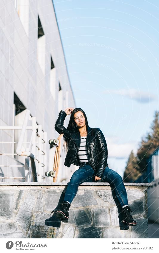 Young woman posing with skateboard 1 Hold Vantage point Adults Skateboarding Youth (Young adults) Leisure and hobbies Longboard Sit Joy Easygoing Girl Street