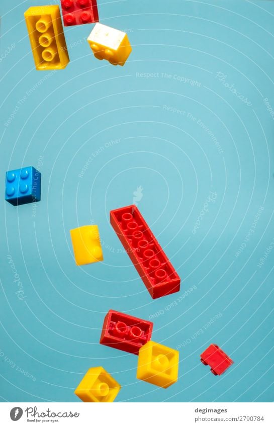 Floating Plastic geometric cubes in the air. Construction toys Design Playing Child Infancy Toys Brick Build Movement Blue Colour blocks falling background rows