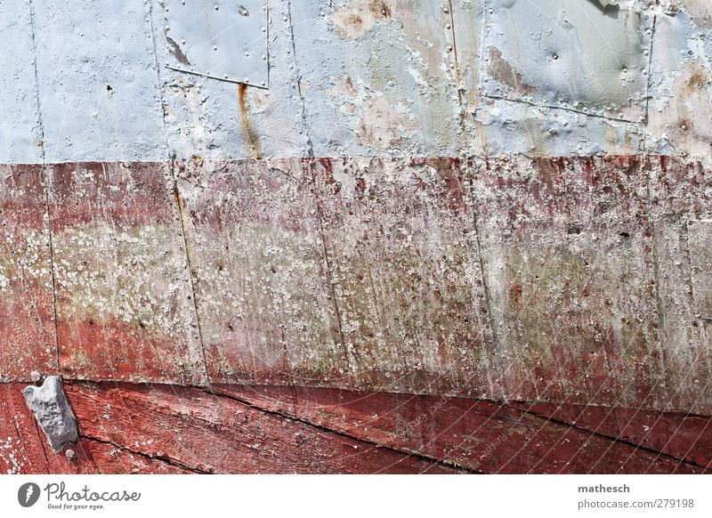 beget sb. Navigation Old boat fuselage Varnish Tracks Blue Red Wood Sea water dockyard maintenance repair Colour photo Exterior shot Deserted Copy Space middle