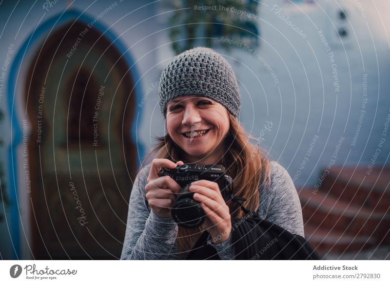 Laughing woman with camera Woman Street Morocco Laughter Photographer Professional Hat Chechaouen Tradition Vacation & Travel Culture City arabic Town