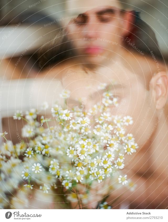 Young man with bunch of flowers in hands Man Mouth Flower Guy Fresh Youth (Young adults) Brunette White shirtless Surprise Gift romantic Daisy