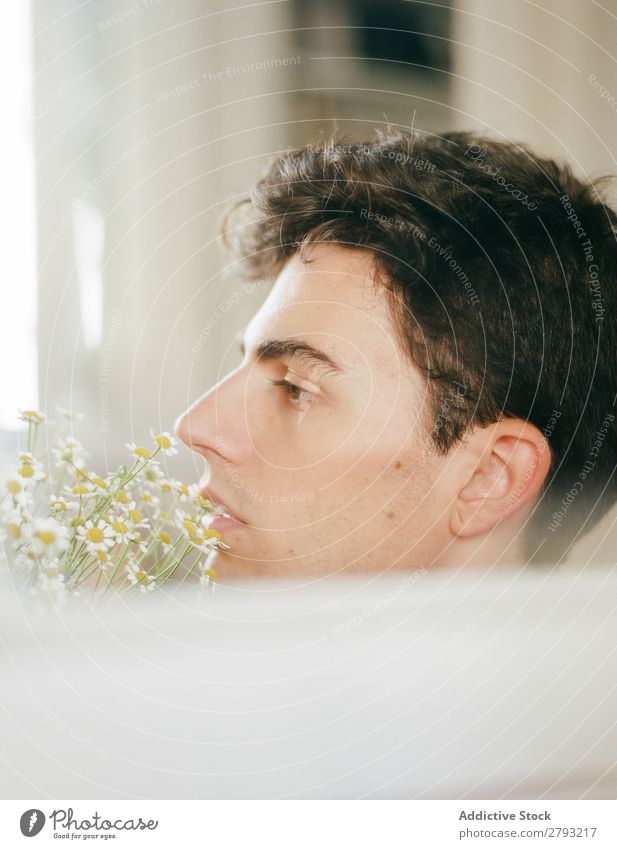 Young man with bunch of flowers in mouth Man Mouth Flower Guy Fresh Youth (Young adults) Brunette White shirtless Surprise Gift romantic Daisy