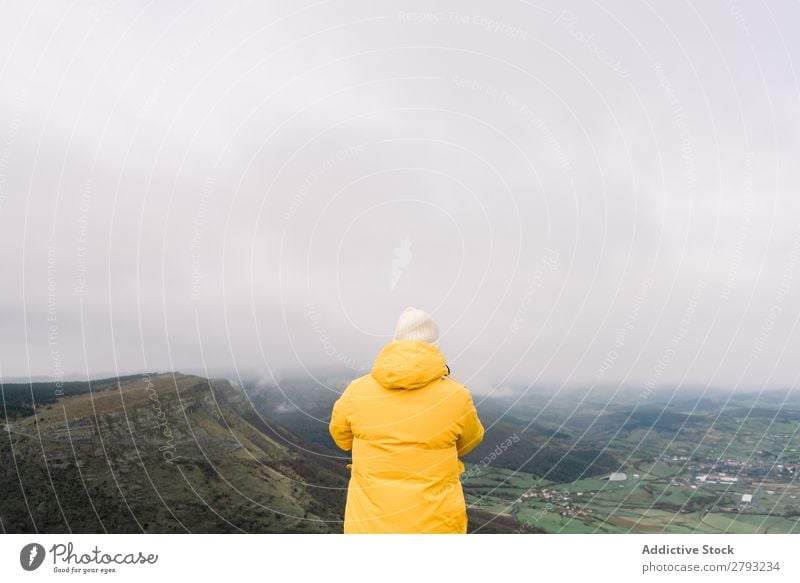 Man standing on top of hill Hill Top orduna Spain Hat Coat Yellow Mountain Sky Clouds Guy Adventure Vacation & Travel Peak Action Cliff Hiking Extreme Nature