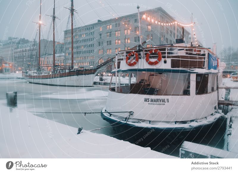 Ship in harbor of Arctic city at night Watercraft Harbour City The Arctic Ice Night Illumination Modern Jetty Vessel Transport Ocean Evening Industry Business