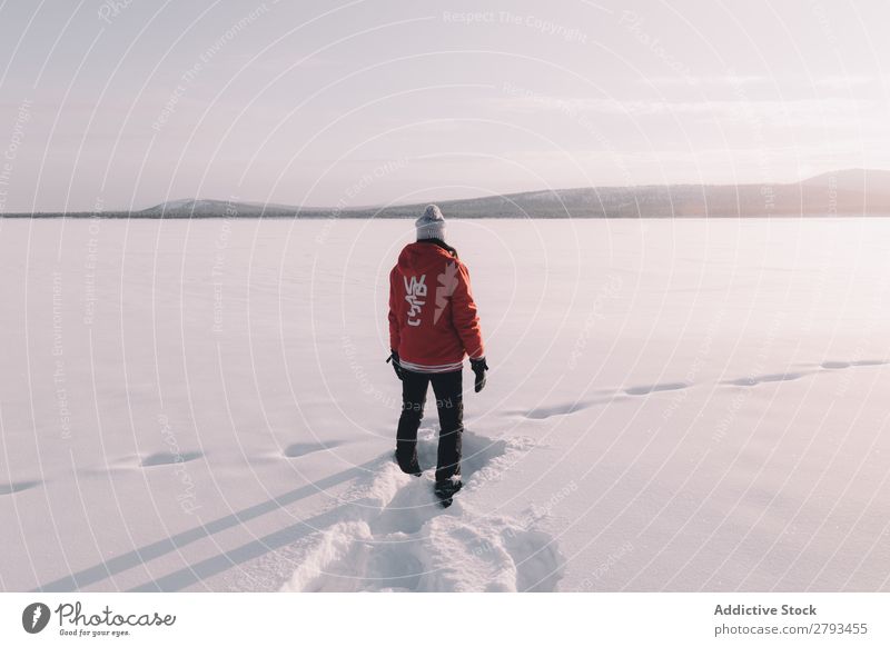 Anonymous person standing in snowy field Human being Field Snow The Arctic Winter Stand warm clothes Cold White Landscape Fresh Seasons Frost Nature Weather