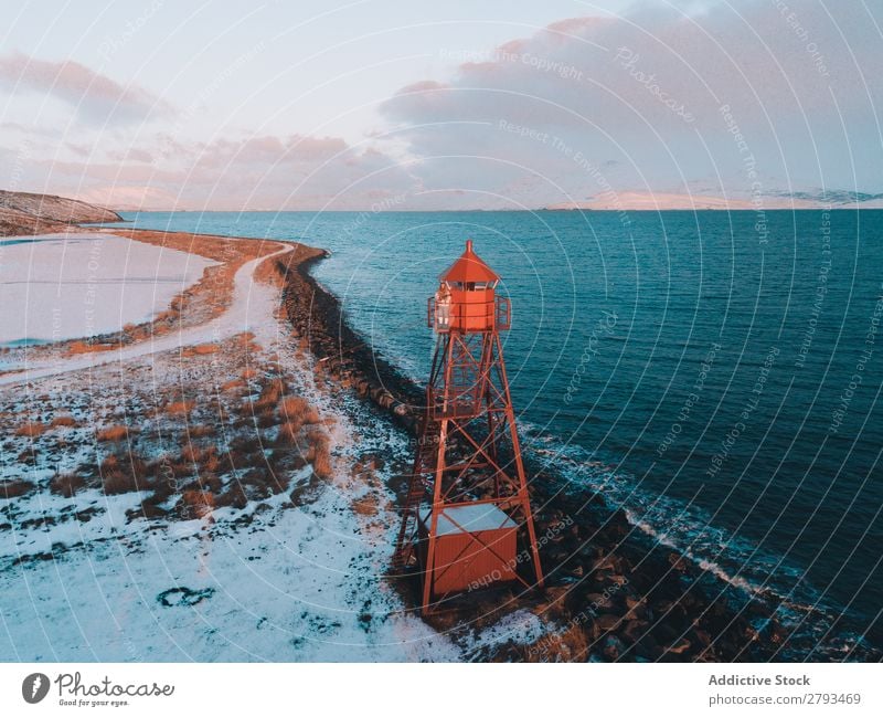 Beacon on snowy shore near sea Coast Ocean The Arctic Cold Snow Winter Landscape Nature Navigation Lighthouse Nautical Landmark Safety Waves Cool (slang) Sky