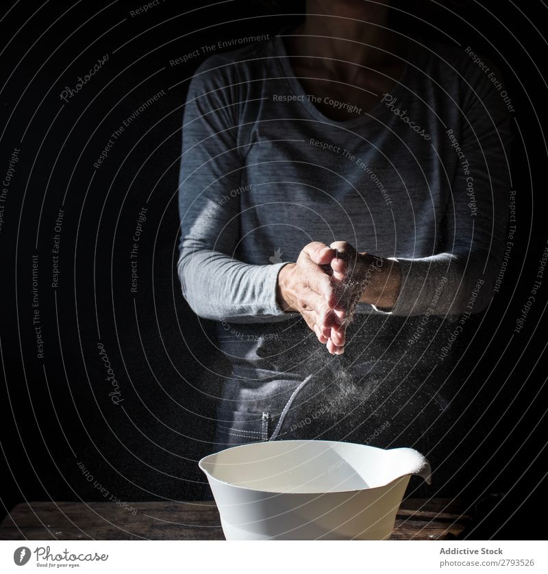 Woman clapping hands in flour near bowl and pack of eggs on table Hand Flour Bowl Egg Pack Table Applause Beater Wood Meal Craft (trade) Tasty Baked goods Lady