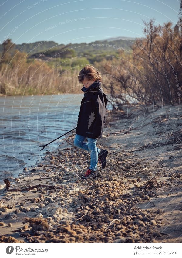 Lady and children putting garbage in basket in park Trash container Basket Park Ground Container Child Putt cleaning up Youth (Young adults) Environment