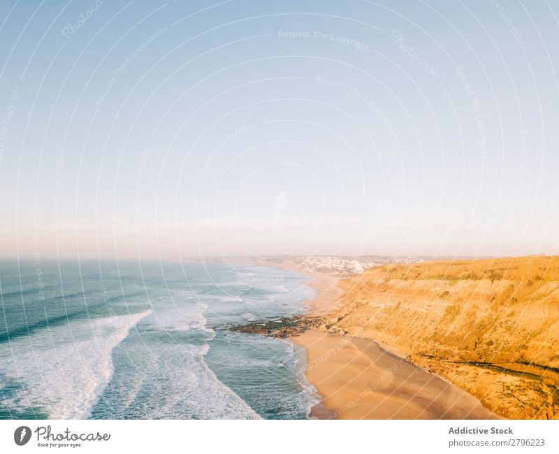 Sea waving near shore Ocean Coast Waves Sky Beautiful weather Water Nature Blue Landscape Beach Vacation & Travel Trip Tourism Cliff Clear rolling Splash Foam