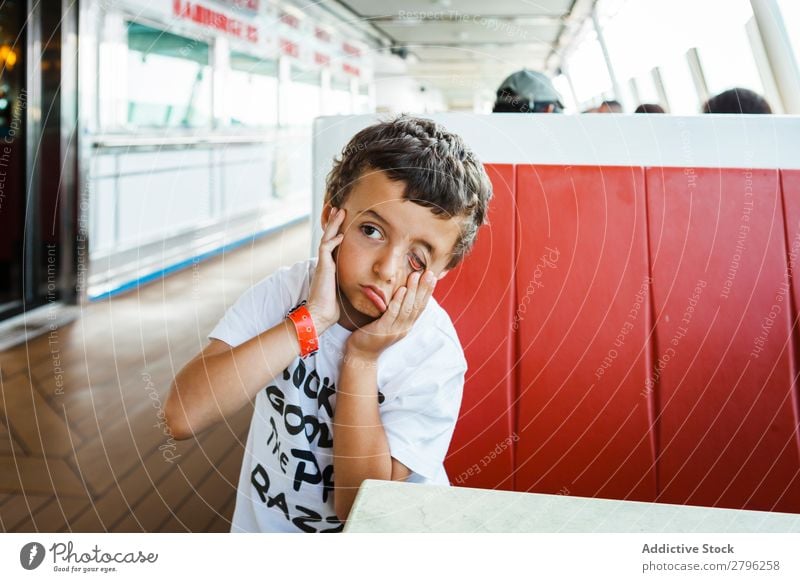 Boy making face with hands on seat Boy (child) Face Child Funny Hand Seat Sit Table Grimace Man Joy Infancy Expression Happiness Lifestyle Gesture brunet Crazy