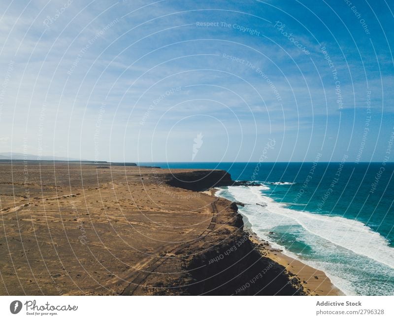 Amazing shoreline of ocean from drone Coast drone view Ocean Cliff Landscape Majestic Spain las palmas Fuerteventura Aircraft Nature Water Waves Power Turquoise