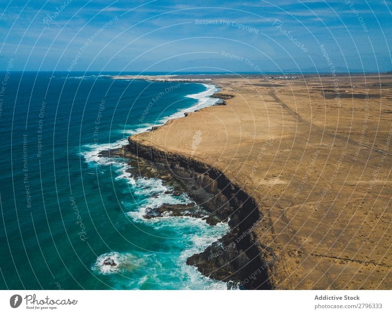 Amazing shoreline of ocean from drone Coast drone view Ocean Cliff Landscape Majestic Spain las palmas Fuerteventura Aircraft Nature Water Waves Power Turquoise