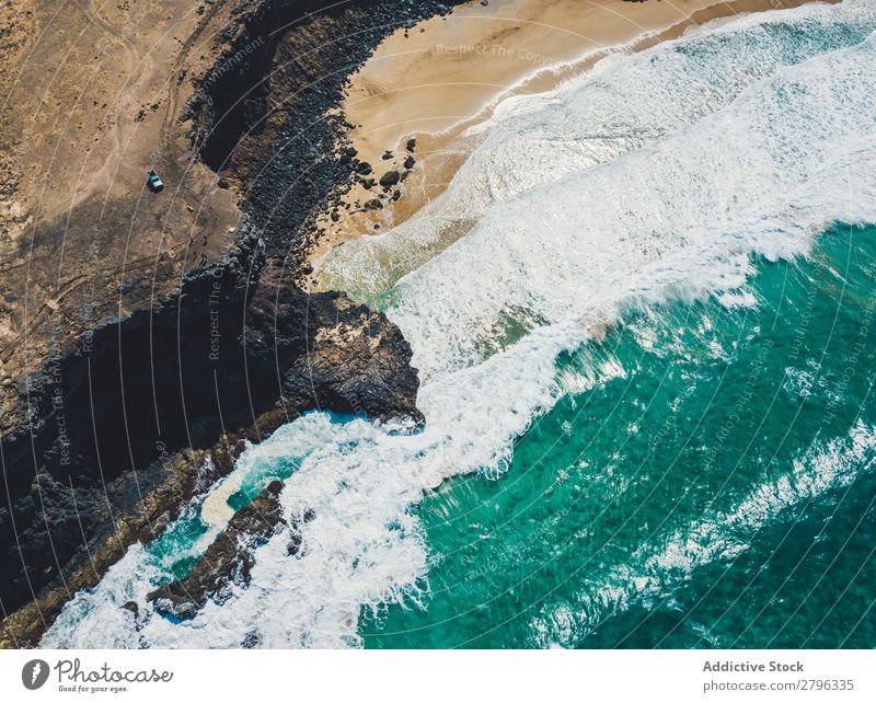 Amazing shoreline of ocean from drone Coast drone view Ocean Cliff Landscape Majestic Spain las palmas Fuerteventura Aircraft Nature Water Waves Power Turquoise