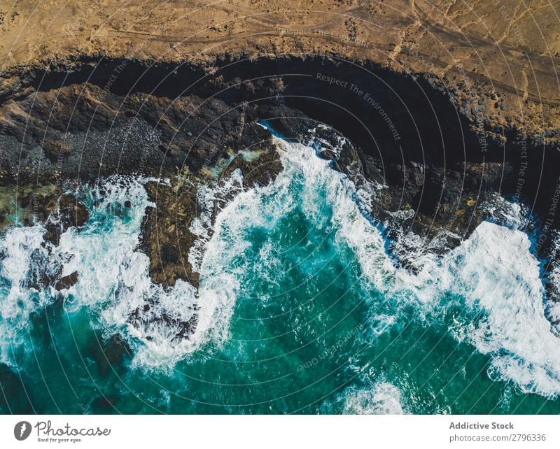 Amazing shoreline of ocean from drone Coast drone view Ocean Cliff Landscape Majestic Spain las palmas Fuerteventura Aircraft Nature Water Waves Power Turquoise