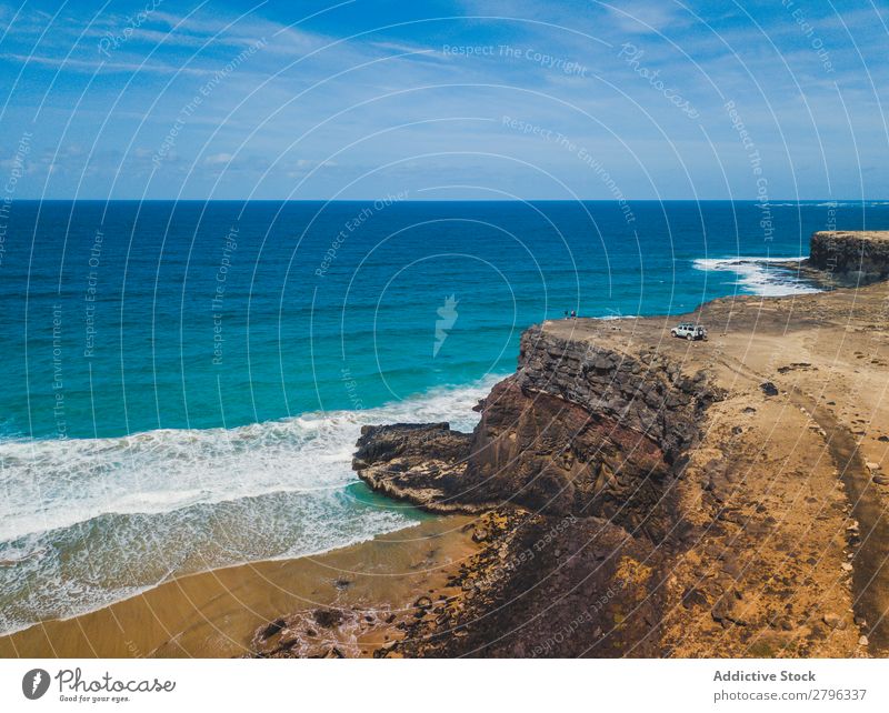 Amazing shoreline of ocean from drone Coast drone view Ocean Cliff Landscape Majestic Spain las palmas Fuerteventura Aircraft Nature Water Waves Power Turquoise