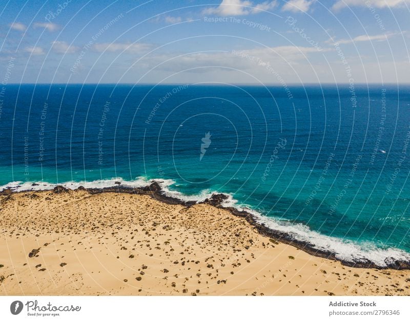 Amazing shoreline of ocean from drone Coast drone view Ocean Cliff Landscape Majestic Spain las palmas Fuerteventura Aircraft Nature Water Waves Power Turquoise