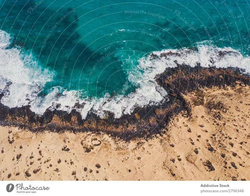 Amazing shoreline of ocean from drone Coast drone view Ocean Cliff Landscape Majestic Spain las palmas Fuerteventura Aircraft Nature Water Waves Power Turquoise