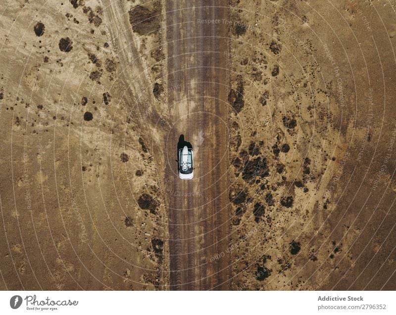 Car driving on road in picturesque desert Desert Spain Aircraft drone view Fuerteventura las palmas Vacation & Travel Street Remote Empty Picturesque