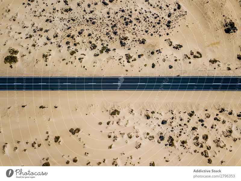 Straight road in sandy desert land Street drone view Desert Line straight Landscape Tourism Fuerteventura las palmas Spain Vacation & Travel Aircraft Remote