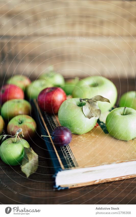 Apples and plum on book Plum Book Table Shabby Autumn Mature Fresh Food Fruit Healthy Seasons Old Rustic Agriculture Vitamin Natural Organic Set Collection