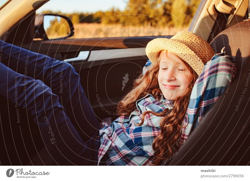 happy child girl relaxing in car during summer road trip Lifestyle Joy Happy Leisure and hobbies Playing Vacation & Travel Trip Adventure Freedom Expedition